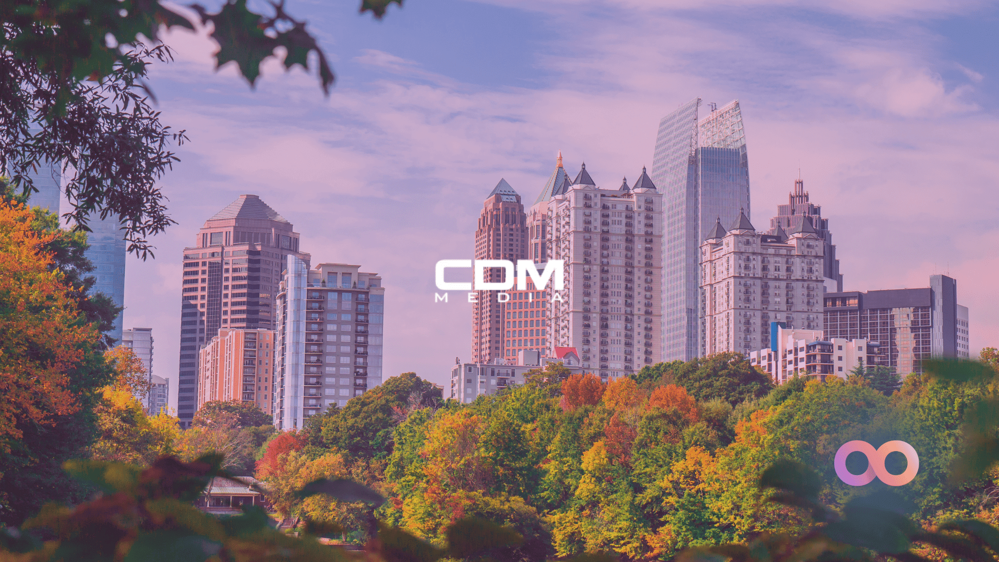 Atlanta city skyline with CCM Media logo and Noetic Cyber logo